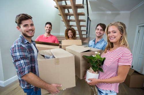 Movers loading boxes during a home move in Edgware