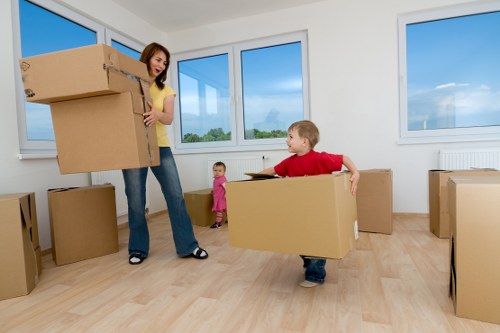 Staff moving desks and IT equipment during an office relocation