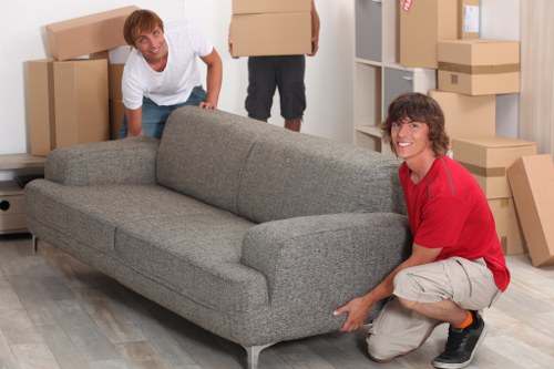 Local moving team preparing boxes in an Edgware property with limited access