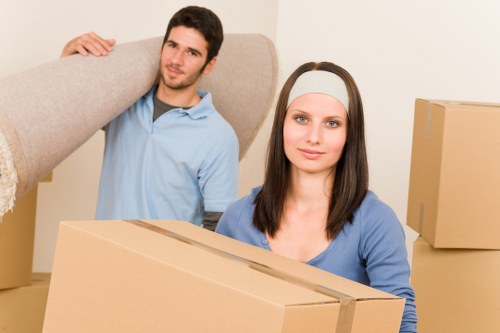 Moving team handling furniture and boxes in Edgware