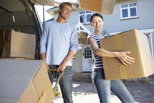 Packed moving boxes and furniture ready for transport in Edgware