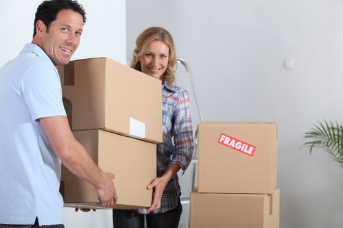 Removal team transporting boxes and household items locally